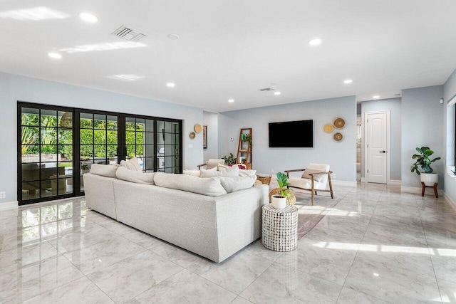 living area with marble finish floor, visible vents, baseboards, and french doors