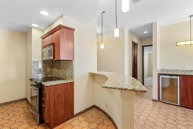 kitchen featuring beverage cooler, decorative backsplash, appliances with stainless steel finishes, a peninsula, and light stone countertops