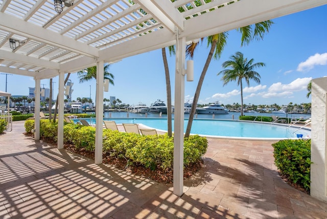 pool featuring a pergola and a patio