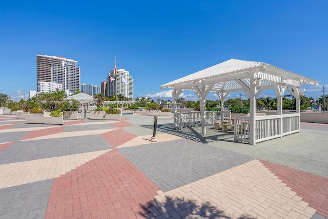 view of home's community featuring a patio area, a city view, and a pergola