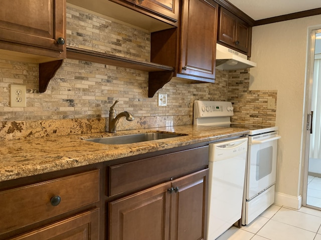 kitchen featuring range with electric stovetop, dishwasher, sink, backsplash, and light stone counters