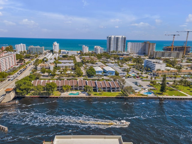 birds eye view of property with a water view