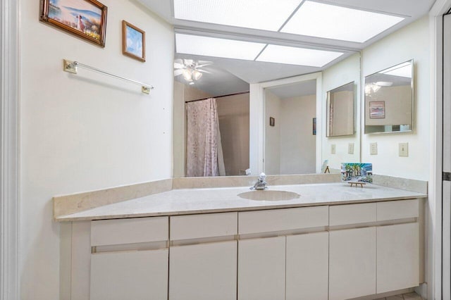 bathroom with vanity and ceiling fan