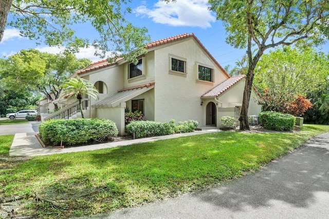 view of home's exterior with a yard