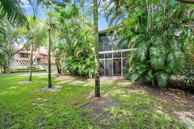 view of yard featuring a sunroom