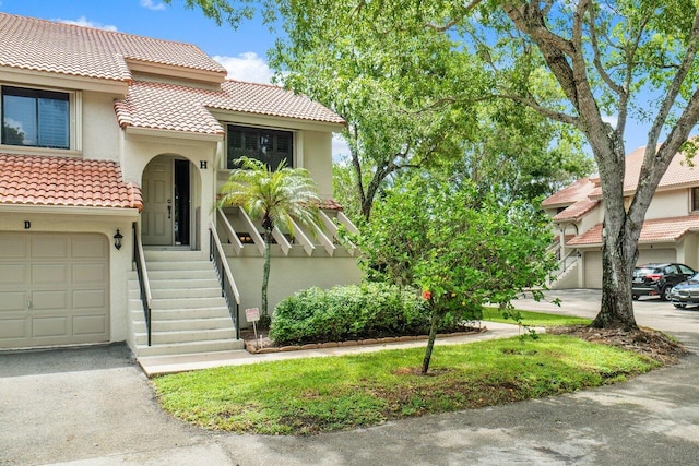 mediterranean / spanish-style home featuring a garage