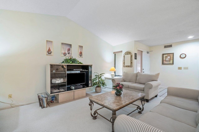 living room with vaulted ceiling and carpet flooring