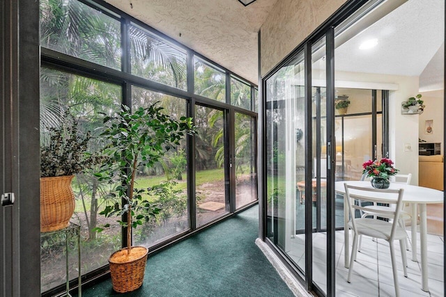 sunroom / solarium featuring plenty of natural light