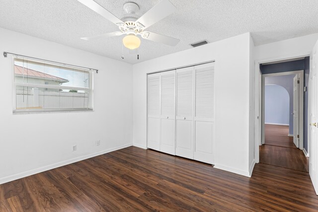 bathroom featuring parquet flooring, vanity, and toilet