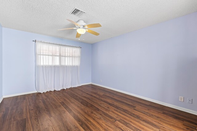 bedroom with ceiling fan, dark hardwood / wood-style flooring, and a textured ceiling