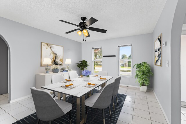 tiled spare room with french doors, ceiling fan, and a textured ceiling