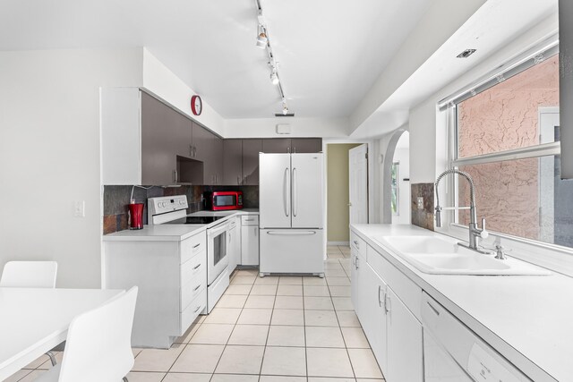 kitchen with sink, white dishwasher, and ceiling fan