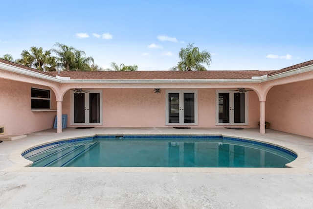 view of swimming pool with a patio, french doors, and ceiling fan