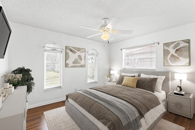 unfurnished bedroom with dark wood-type flooring, a textured ceiling, and a closet