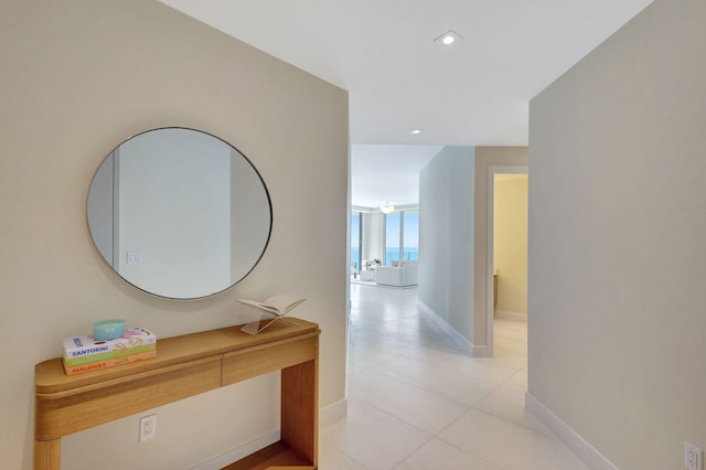 corridor featuring light tile patterned floors