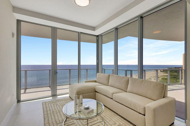 sunroom with a water view and a healthy amount of sunlight