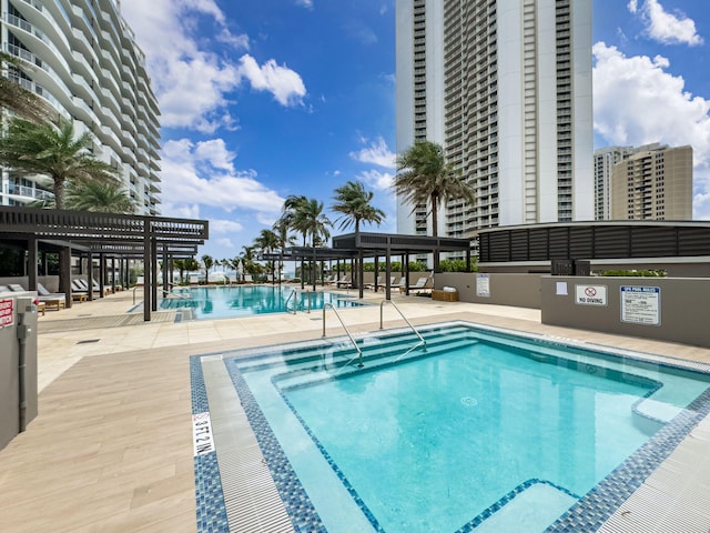 view of pool featuring a pergola and a patio area