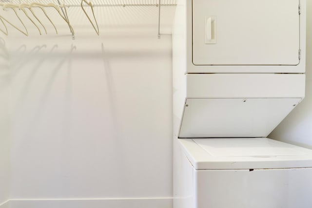 laundry area with stacked washer / drying machine