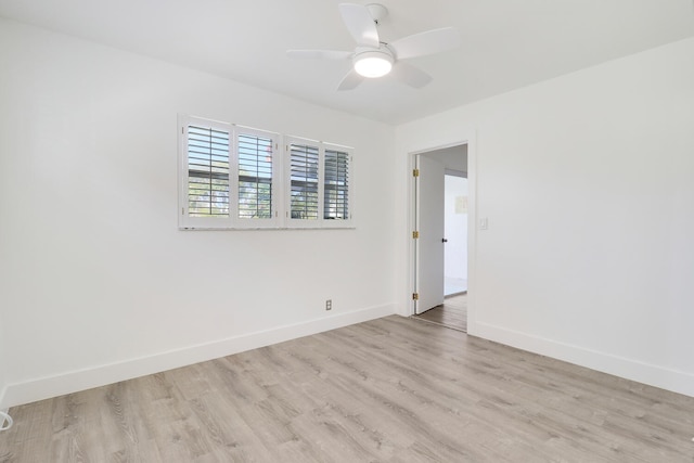 spare room featuring ceiling fan and light hardwood / wood-style floors