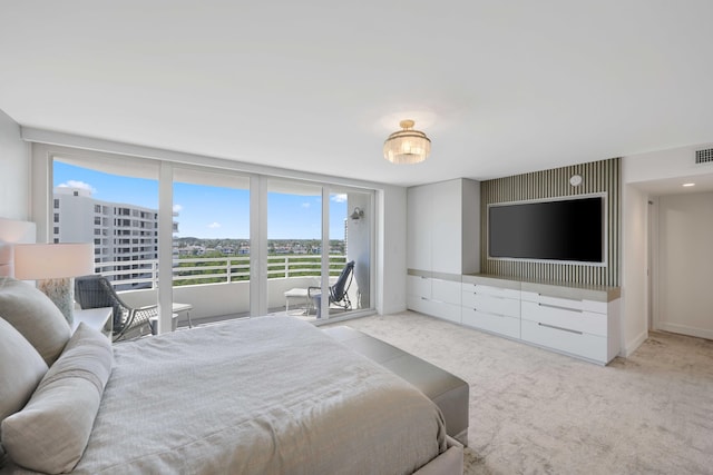 bedroom featuring light colored carpet