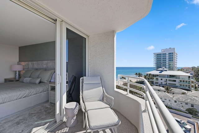 balcony featuring a water view