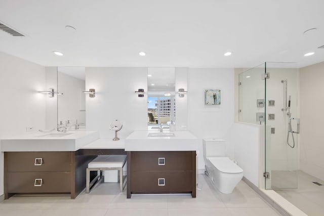 bathroom with tile patterned flooring, walk in shower, vanity, and toilet