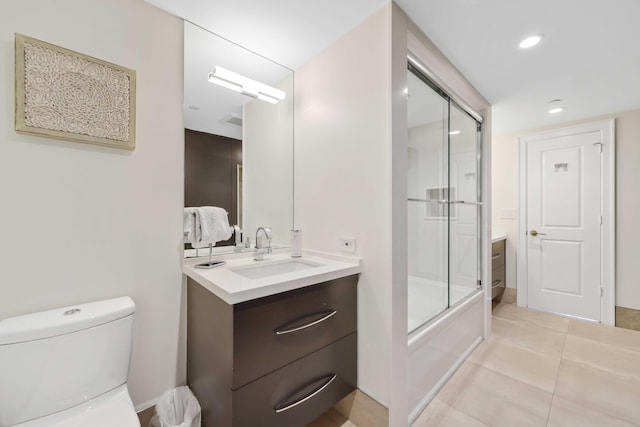 full bathroom with vanity, toilet, tile patterned flooring, and combined bath / shower with glass door