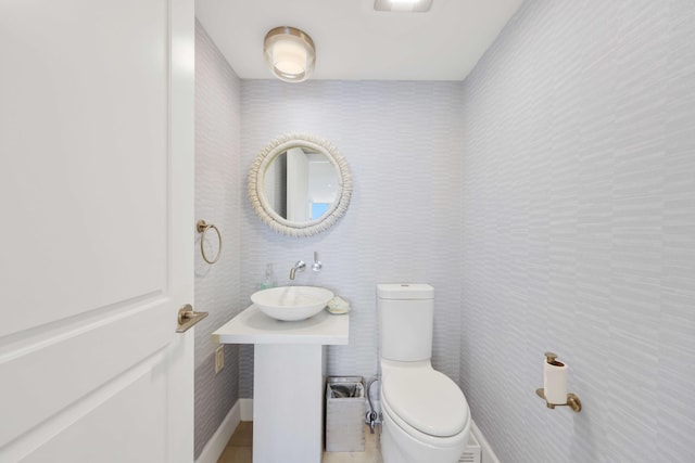 bathroom featuring sink and toilet