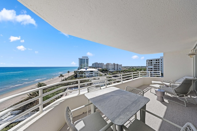 balcony with a view of the beach and a water view