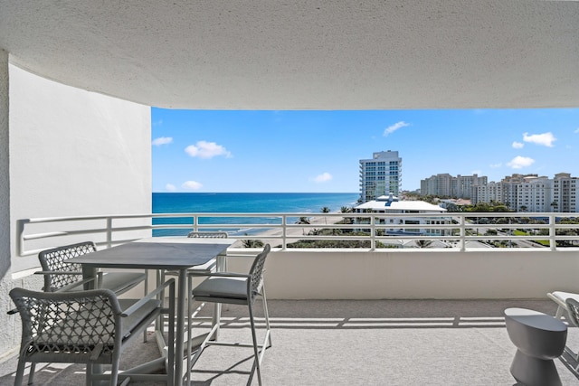 balcony featuring a water view