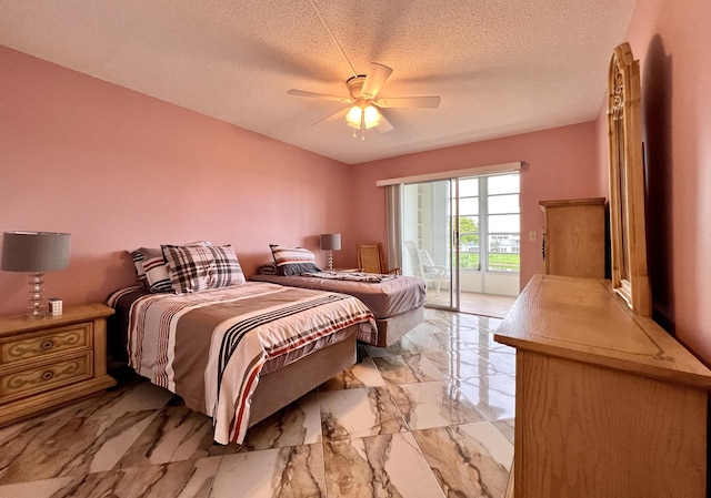 bedroom with access to exterior, a textured ceiling, and ceiling fan