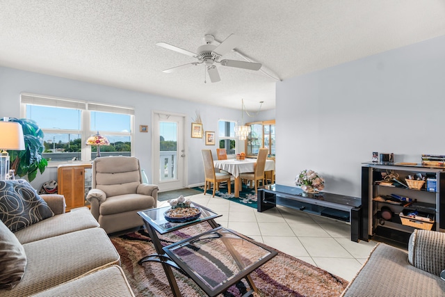 tiled living room featuring ceiling fan and a textured ceiling