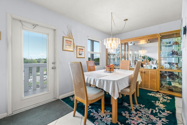 dining area featuring an inviting chandelier, plenty of natural light, and carpet