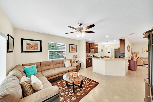 tiled living room featuring ceiling fan