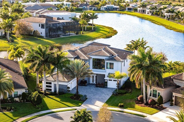 birds eye view of property featuring a water view