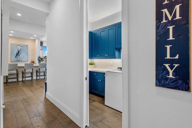 hall with dark wood-type flooring