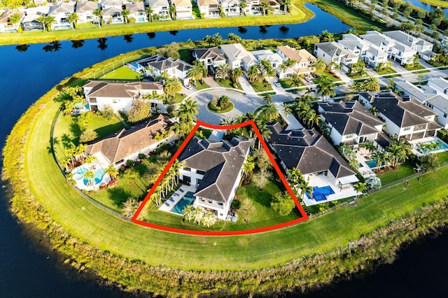 birds eye view of property featuring a water view