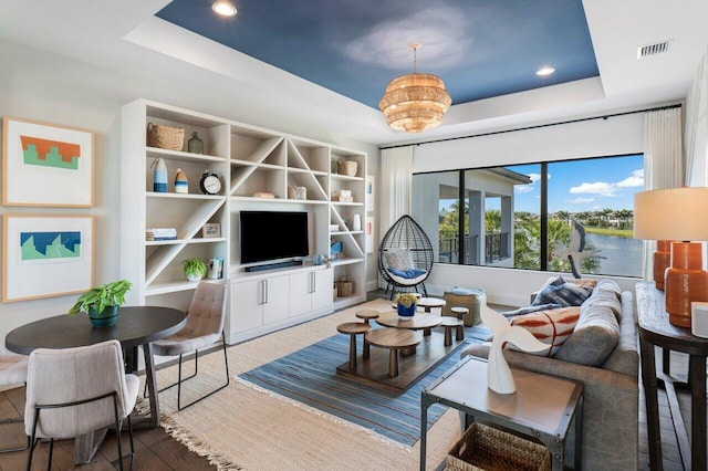 living room featuring a tray ceiling