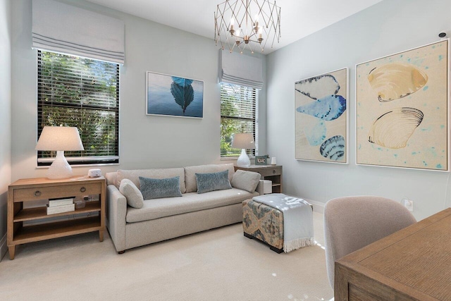 living room featuring a notable chandelier and carpet floors