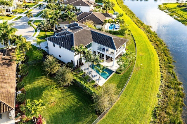 birds eye view of property with a water view