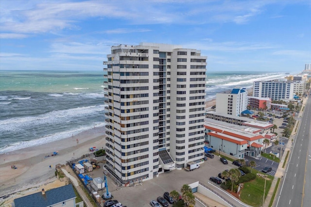 aerial view featuring a water view and a beach view