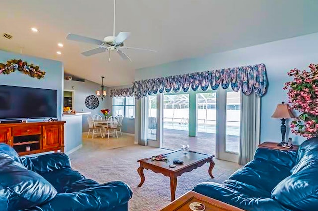 living room with lofted ceiling, light colored carpet, and ceiling fan