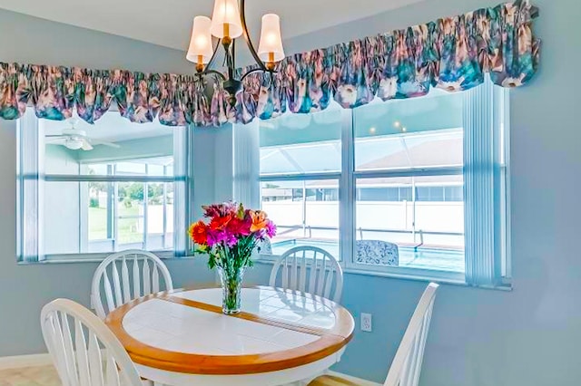 dining space featuring an inviting chandelier