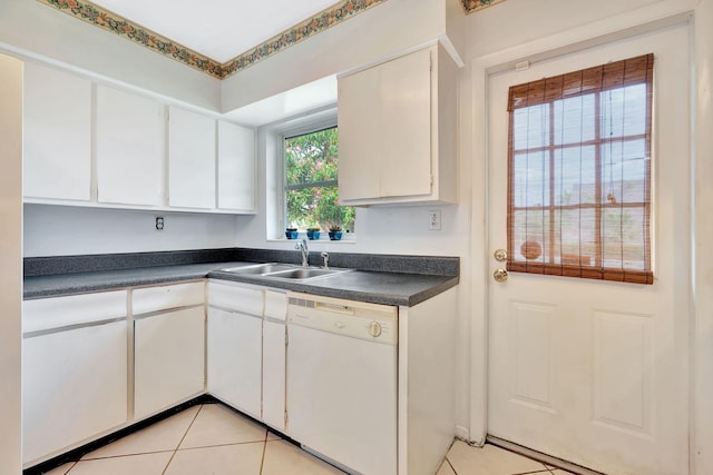 kitchen featuring white cabinetry, sink, light tile patterned floors, and white dishwasher