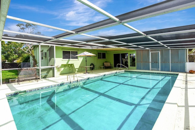 view of pool featuring a lanai and a patio area