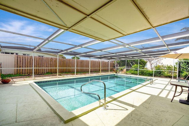 view of pool with a lanai and a patio area