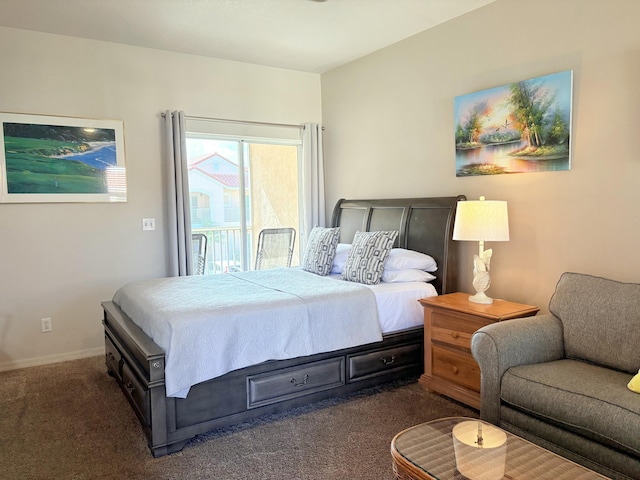 bedroom featuring baseboards, dark colored carpet, and access to exterior