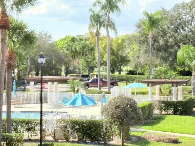 community pool featuring fence