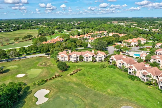 bird's eye view with view of golf course and a residential view