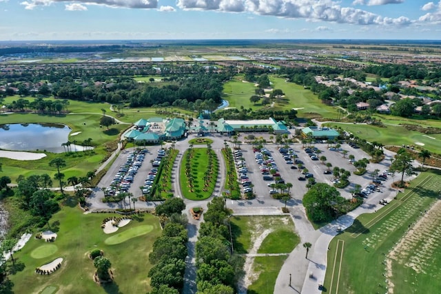 bird's eye view featuring a water view and golf course view